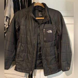 The North Face jacket. Great for layering, warm but not a puffer coat. Size L